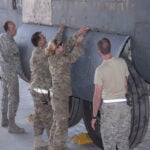 USAF’s combat metals team repairs and refits C-130 Hercules landing gear door