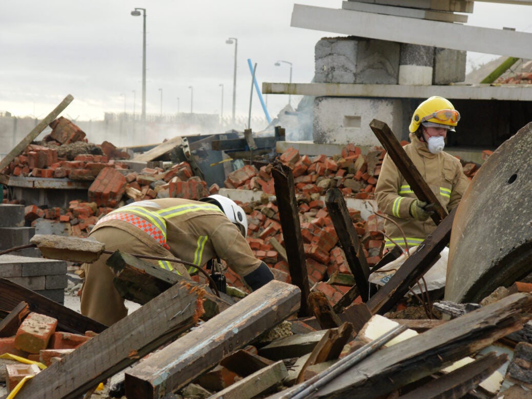 Emergency workers clearing rubble